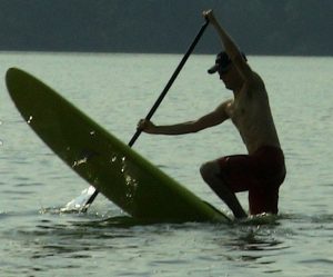 Man Paddle Boarding on a Lake