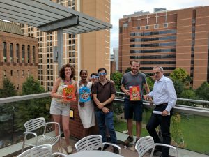 Team Members Gather Outside with Cereal Boxes to Watch Solar Eclipse in August 2017